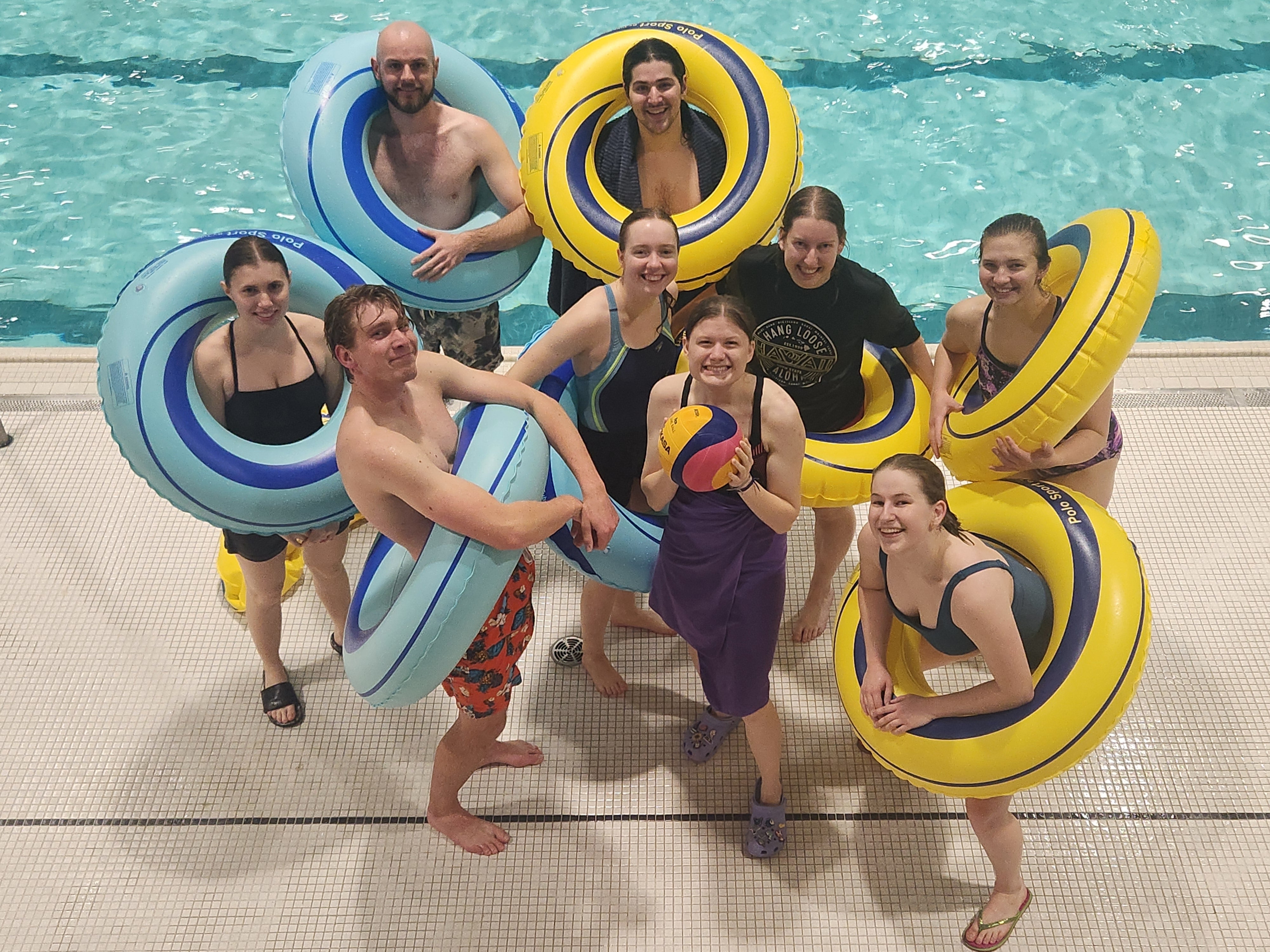 Intramural team by the pool with innertubes 