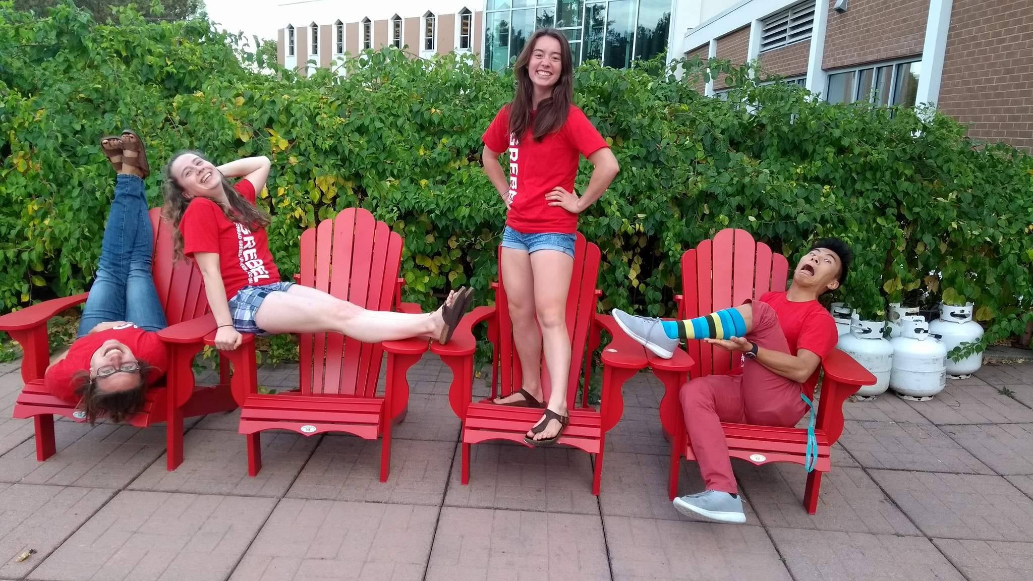 Grebel Students sitting on Muskoka chairs