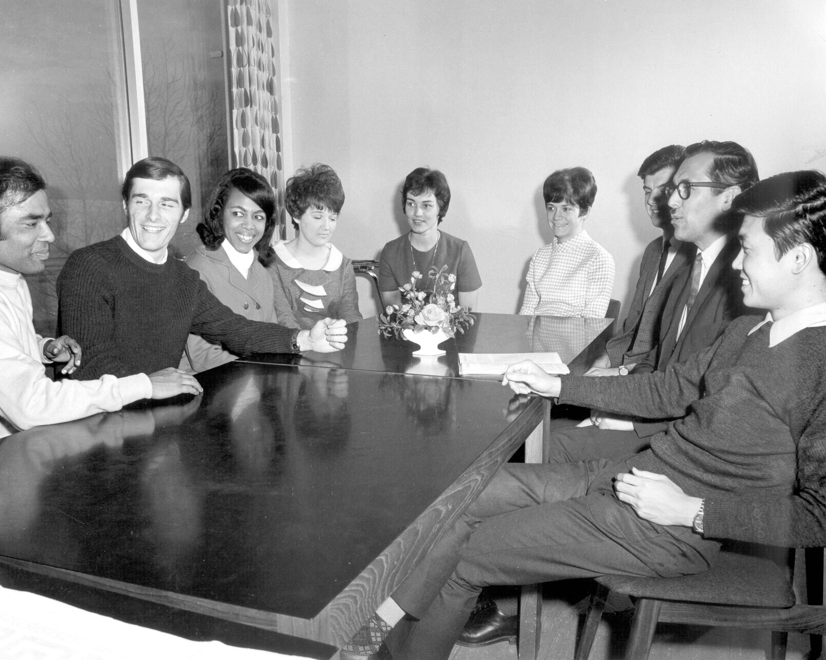 walter klaassen siting around table with students