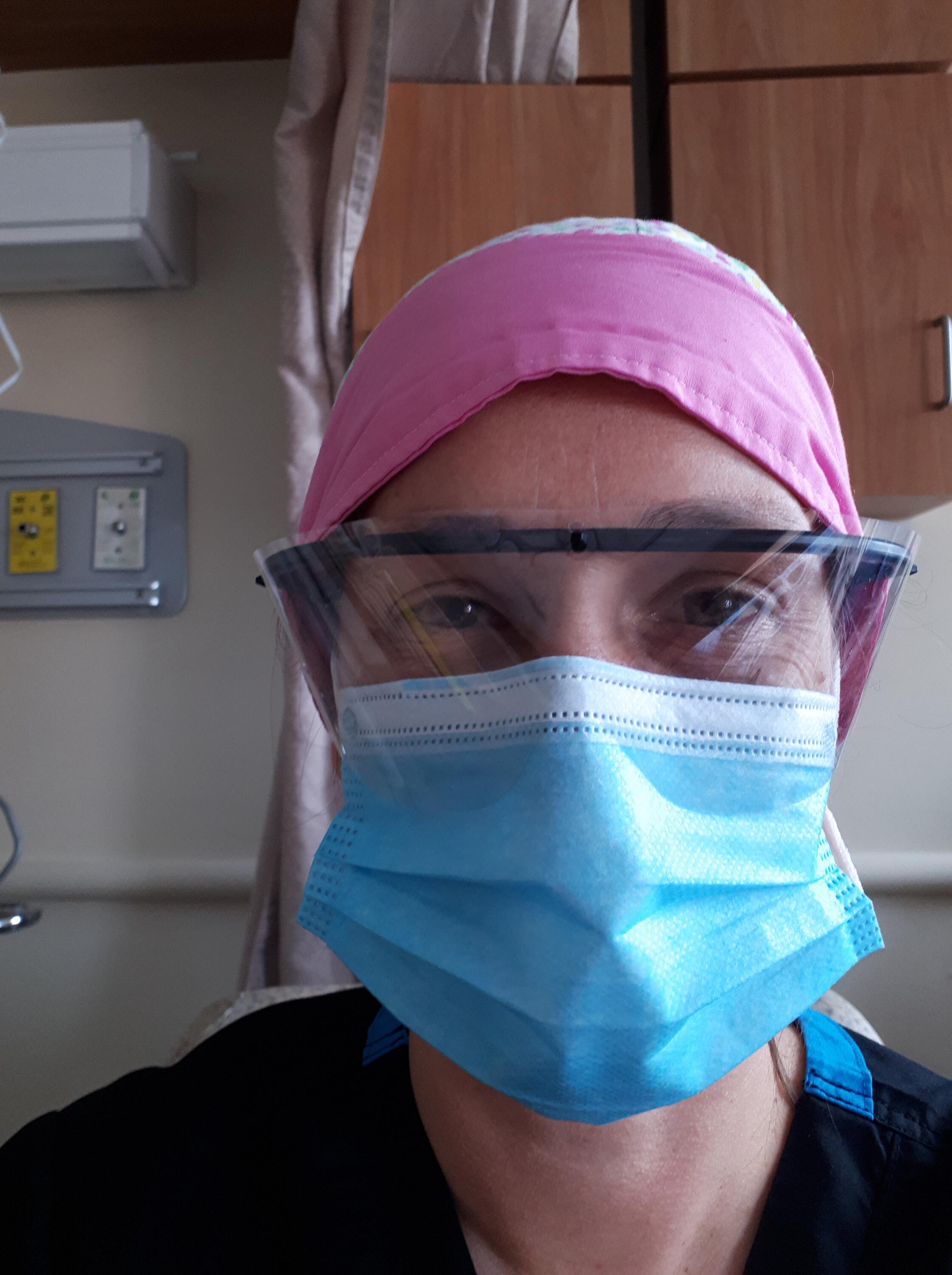 Alisa wears her protective equipment at the hospital