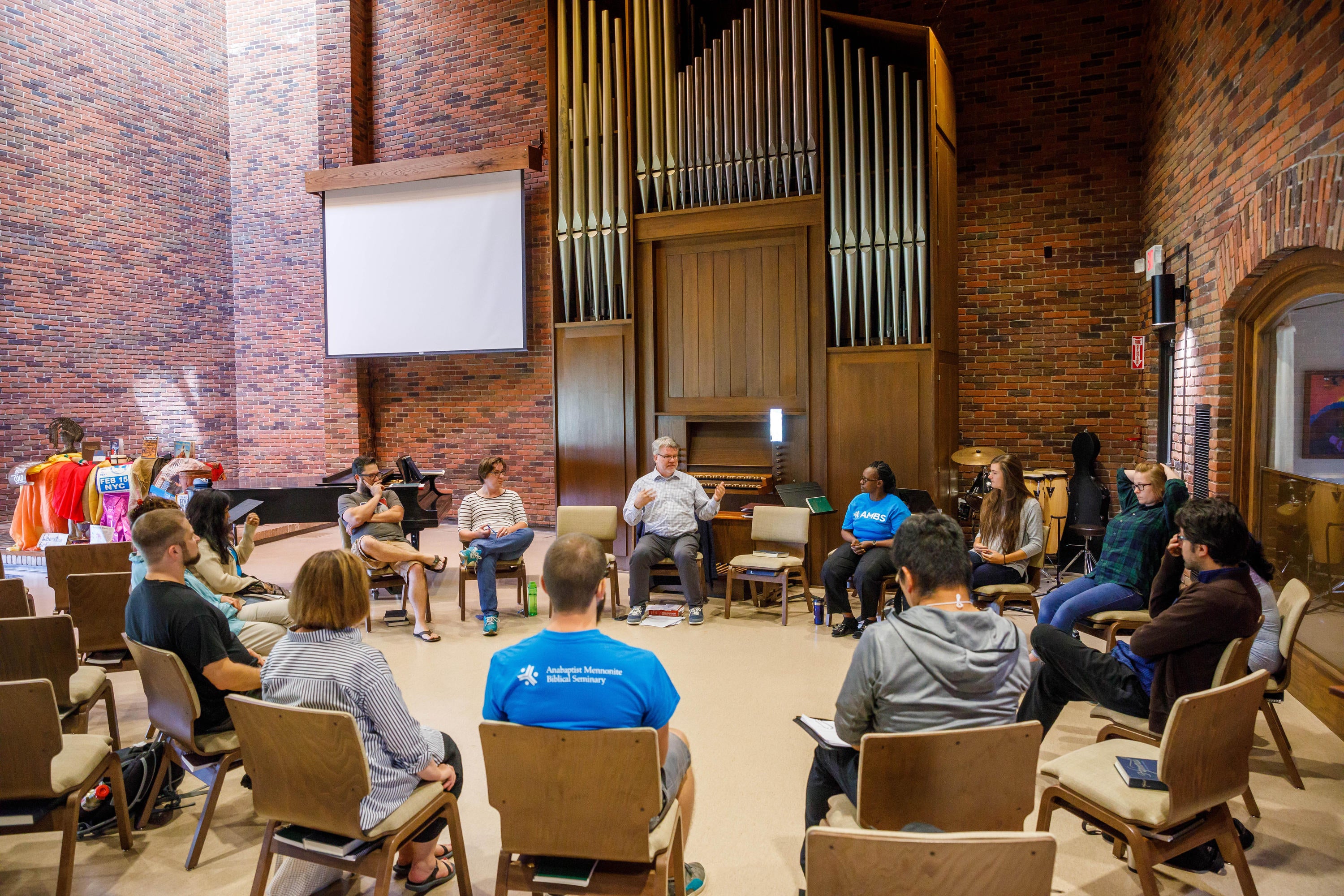Allan Rudy-Froese, AMBS Associate Professor of Christian Proclamation, leads an orientation session for incoming students in the Chapel of the Sermon on the Mount in August 2017. (Credit: Peter Ringenberg)