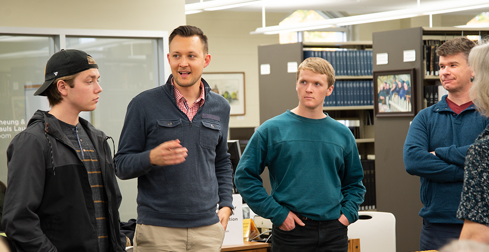 David Neufeld speaks at a class in the library