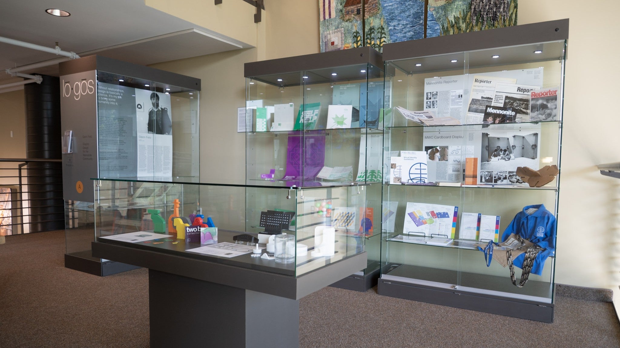 Exhibit display, several full display cases on the third floor landing. 