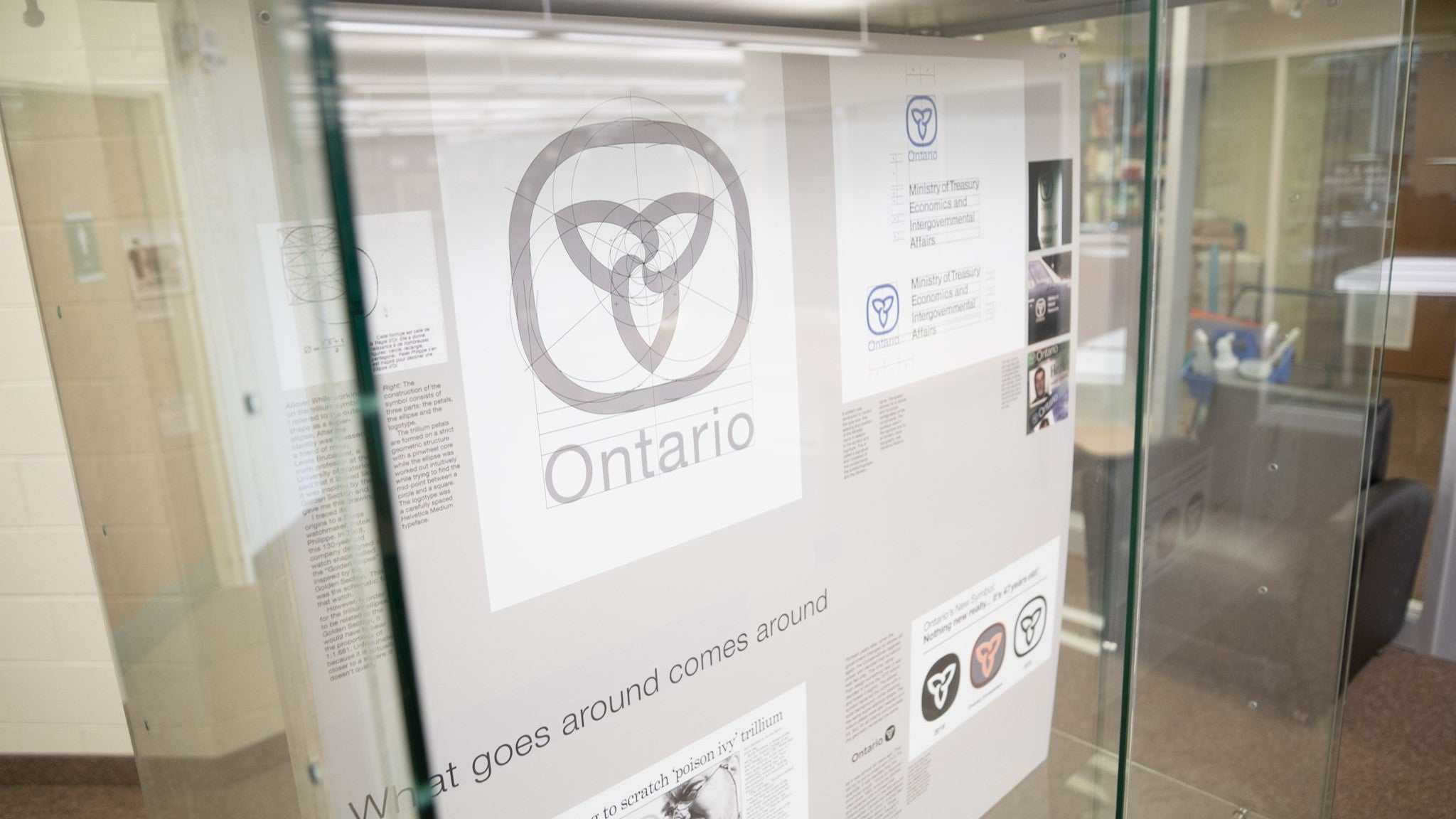 Exhibit display, featuring behind the scenes images of the Government of Ontario logo