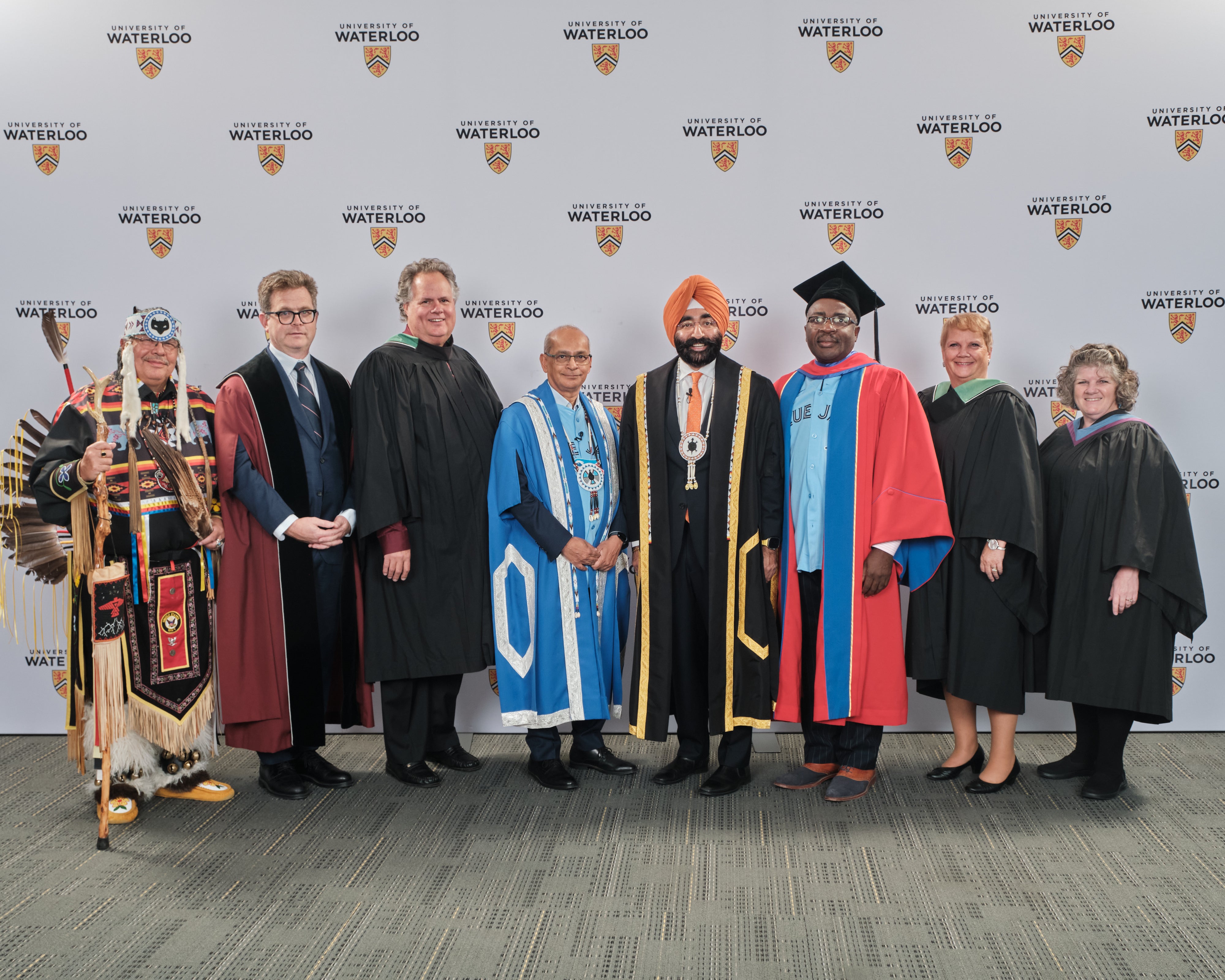 8 people in academic regalia