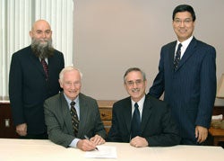 Myroslaw Tataryn, Acting President , St Jerome’s University, (left), David Johnston, President, University of Waterloo, Henry Paetkau, President, Conrad Grebel University College and Amit Chakma Vice-President, Academic and Provost, gathered to sign the agreement that will see funding flow to Conrad Grebel University College and St. Jerome’s University for their graduate programs in theological studies.