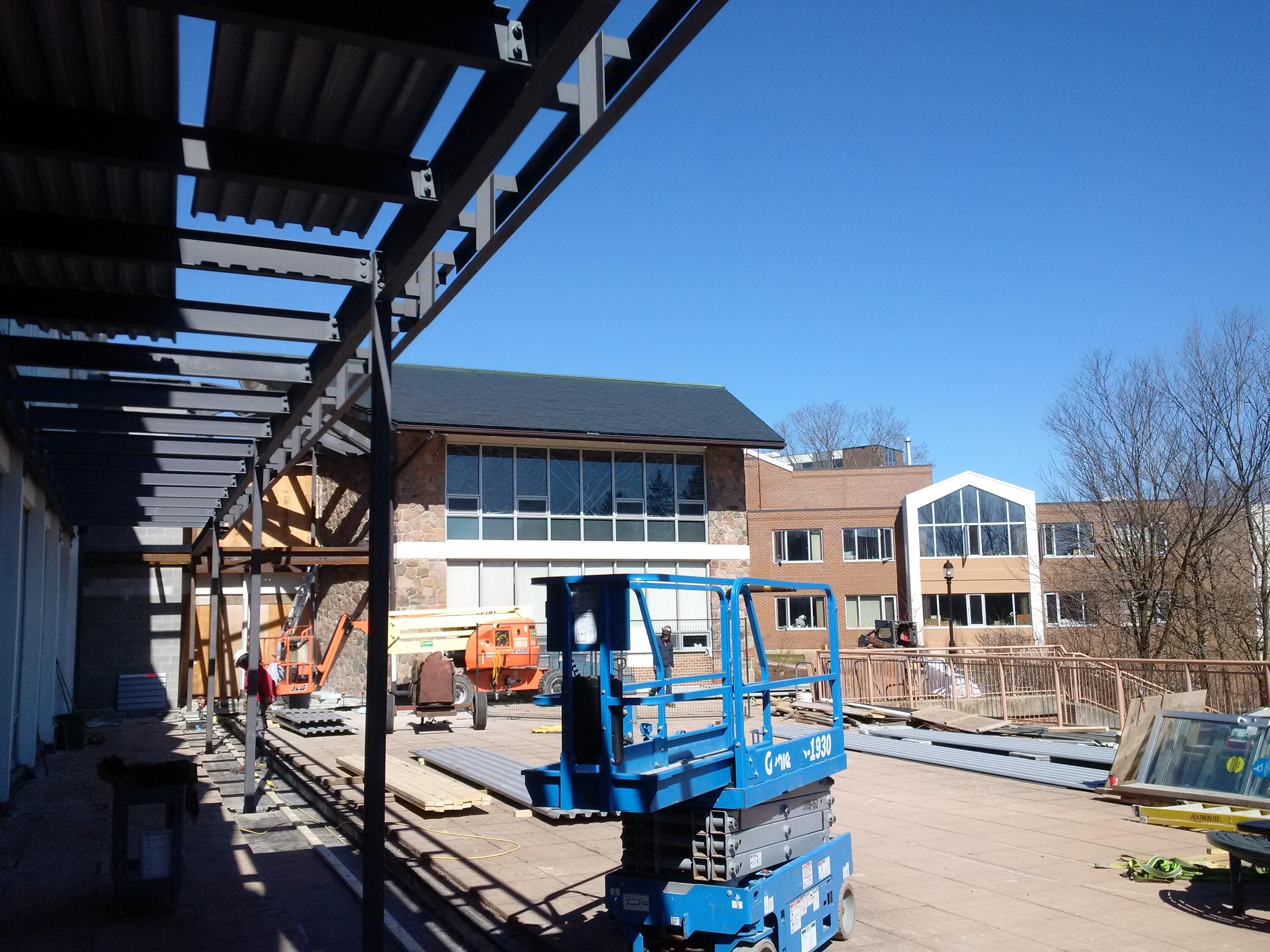 Steel goes up outside the grebel patio
