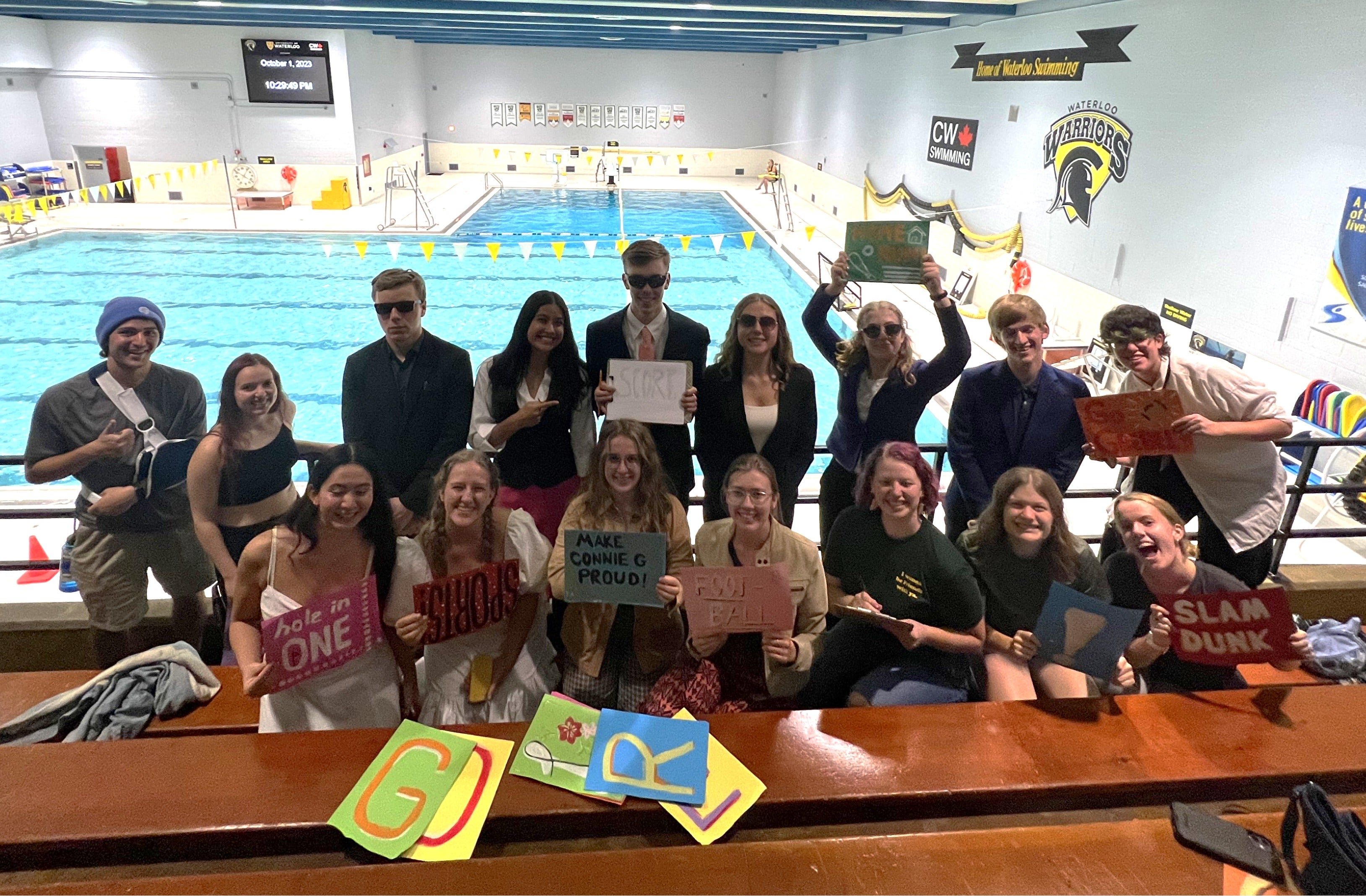 Students cheering on a swim team