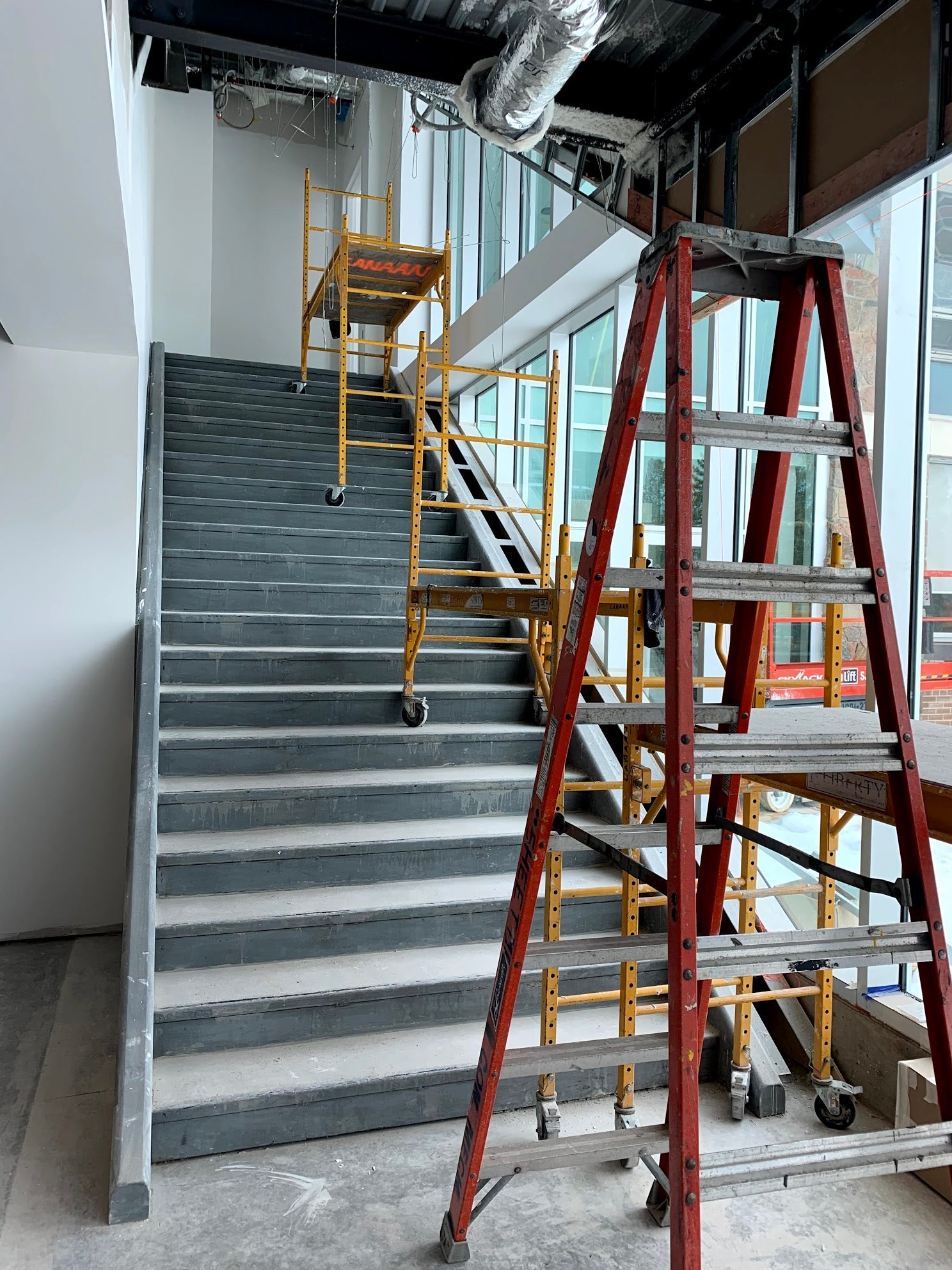 new stairs towards the chapel, with windows and construction ladders