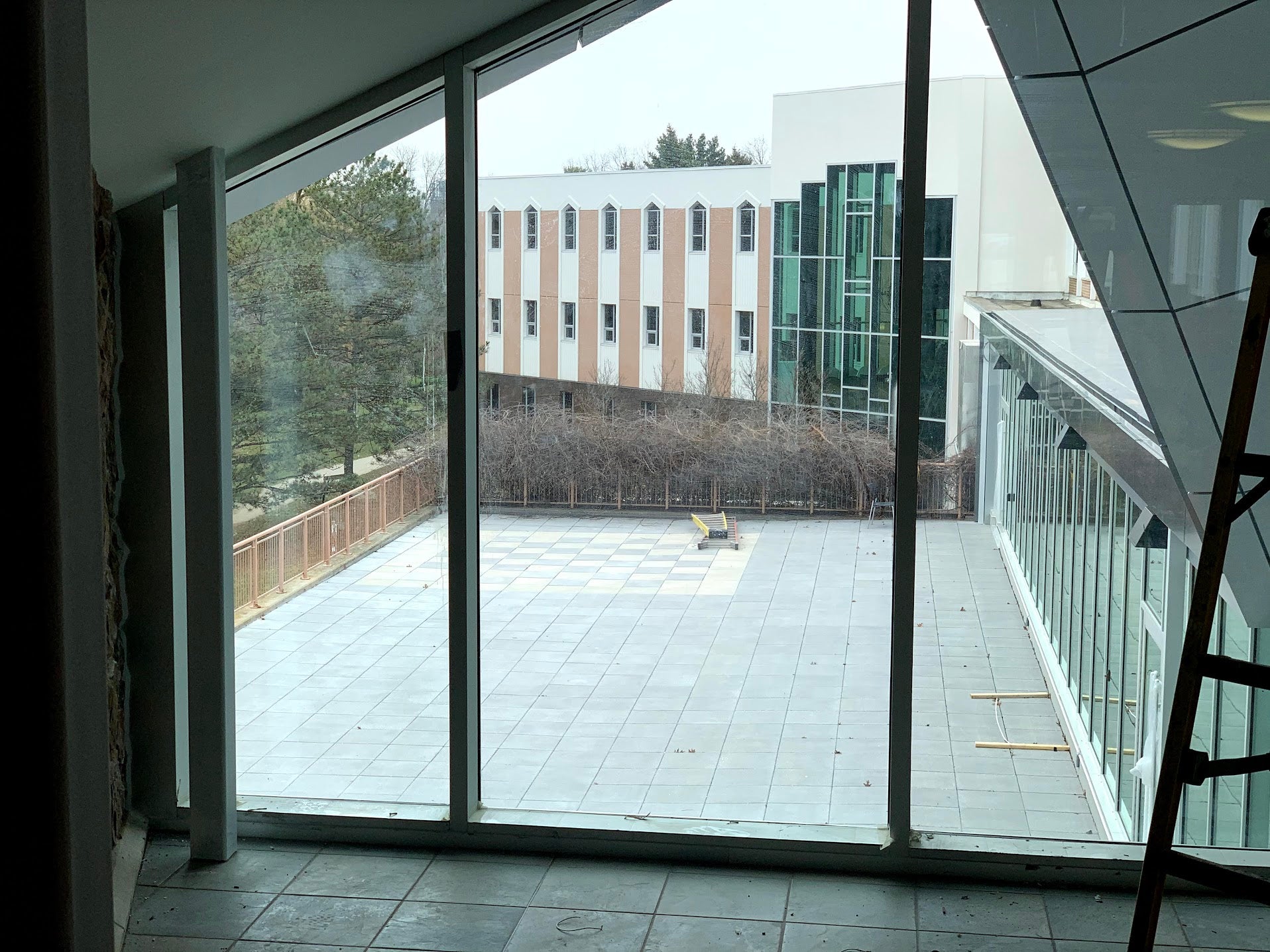 view of the new patio stones, including a chess board layout in the far corner. 