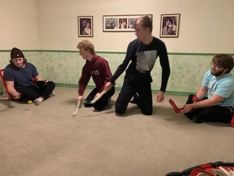 Grebelites playing Mini Sticks in Grandma Roth's basement