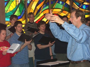 Len Enns conducts the Chapel Choir