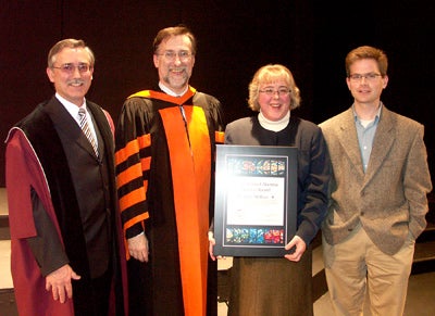 Lynn McRuer receiving Grebel's Distinguished Alumni Service award 