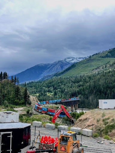 A scenic view of Lytton, BC, with mountains overlooking construction