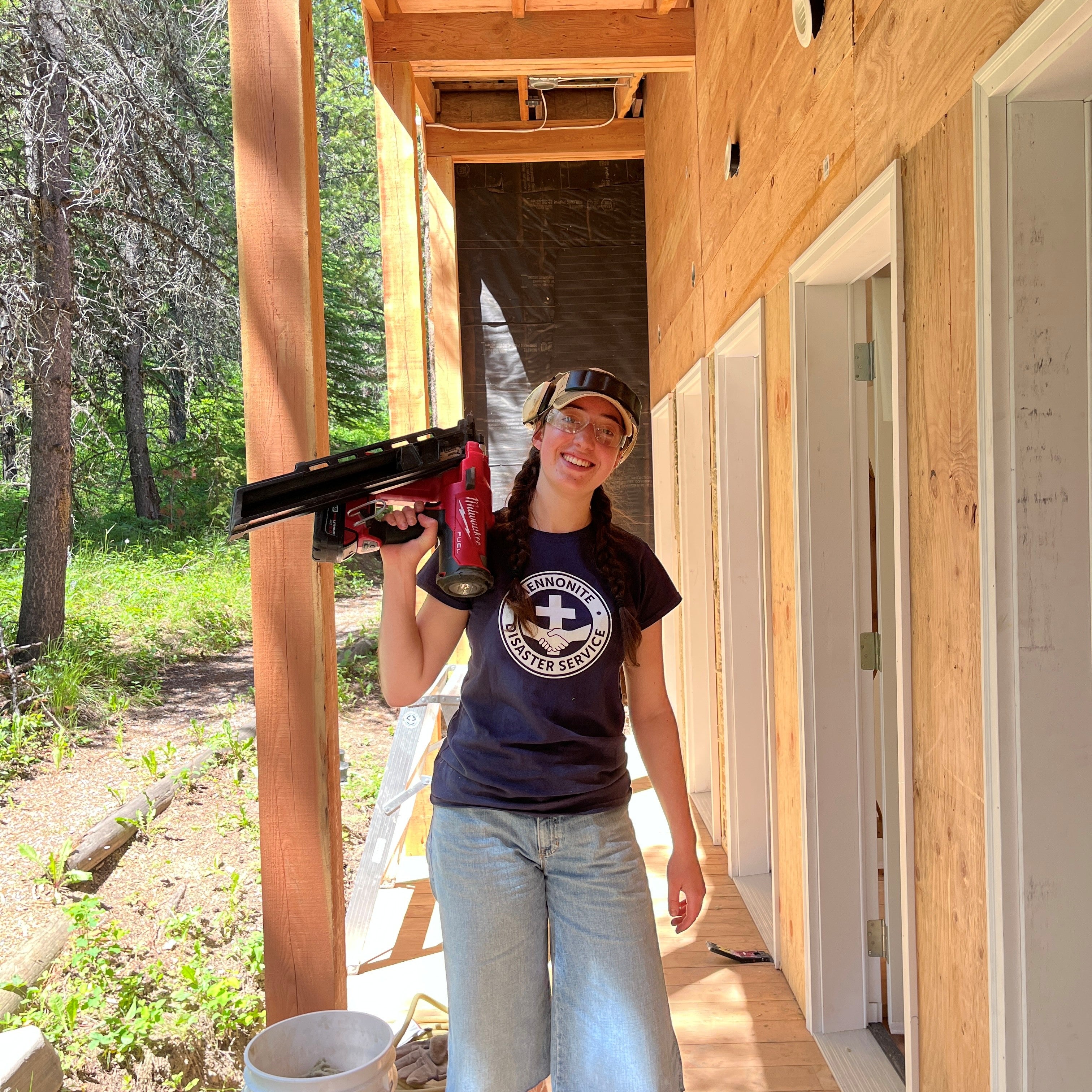 Mona Bailey on an MDS work site with a drill