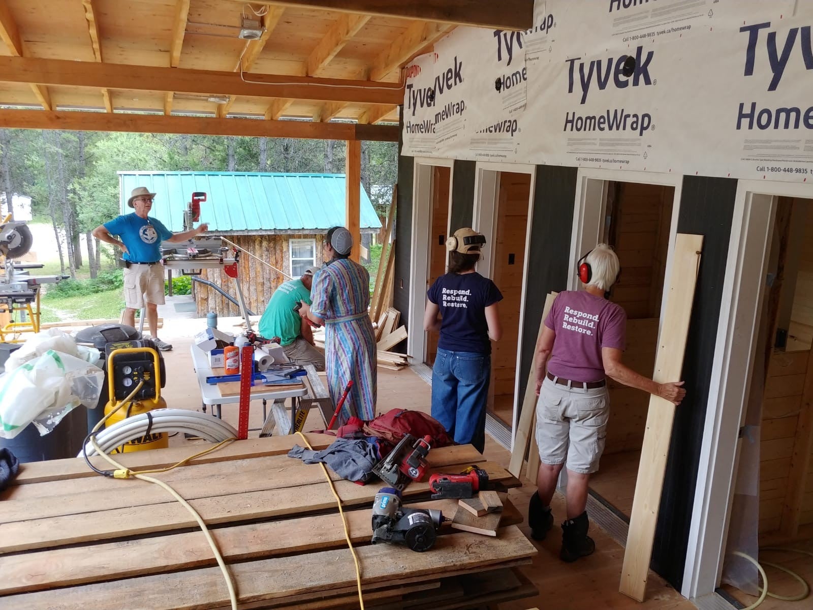 Mona Bailey and other volunteers working on a construction site
