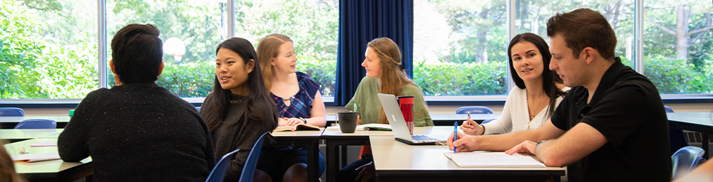 Students collaborating at their desks