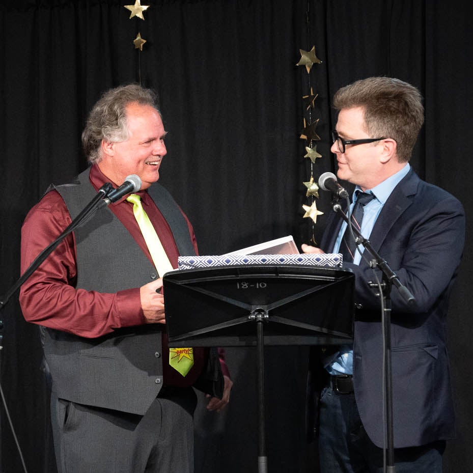 Paul Penner receiving a retirement gift from Marcus Shantz