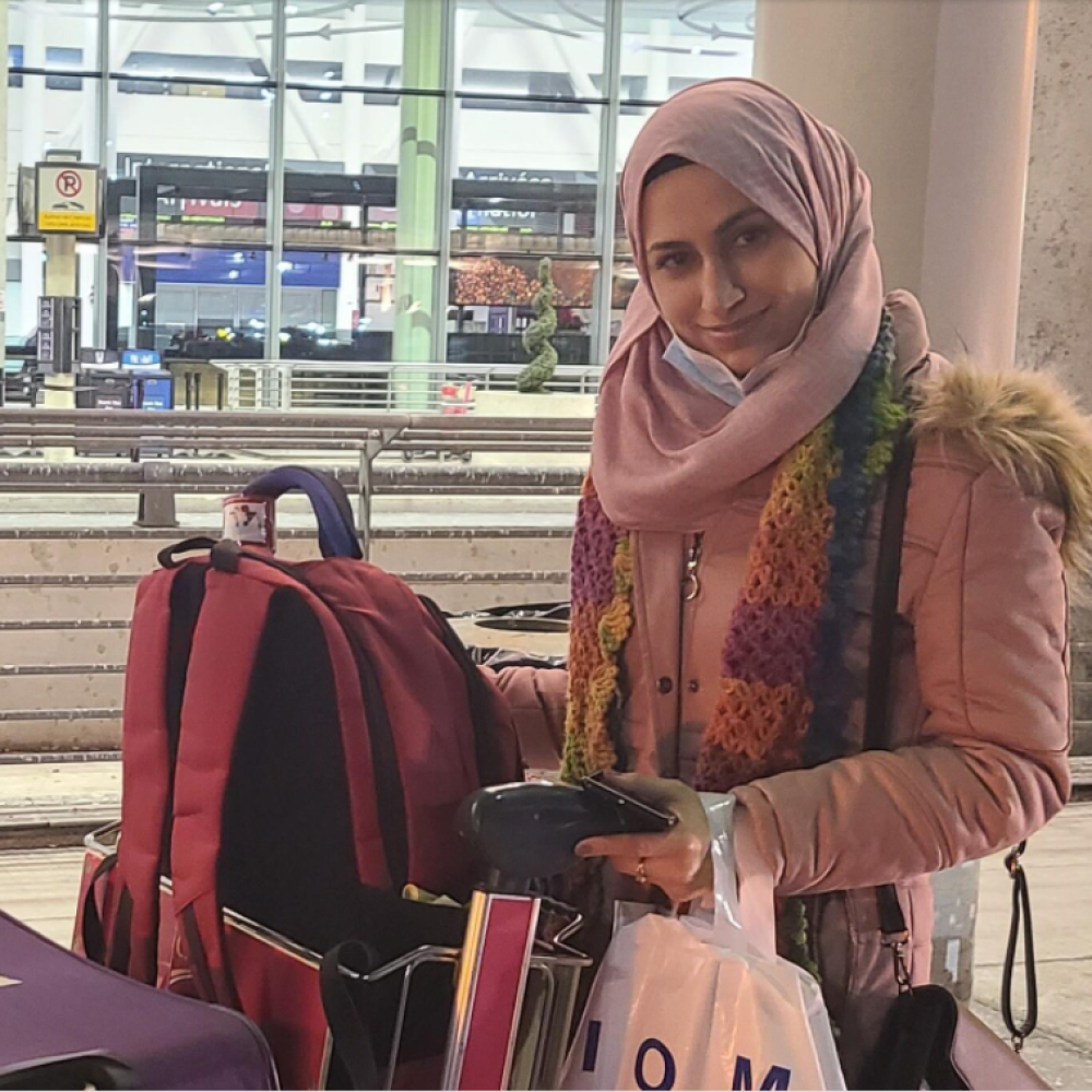 Reema with her bags exiting the airport