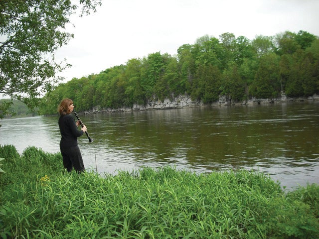 Musician by river