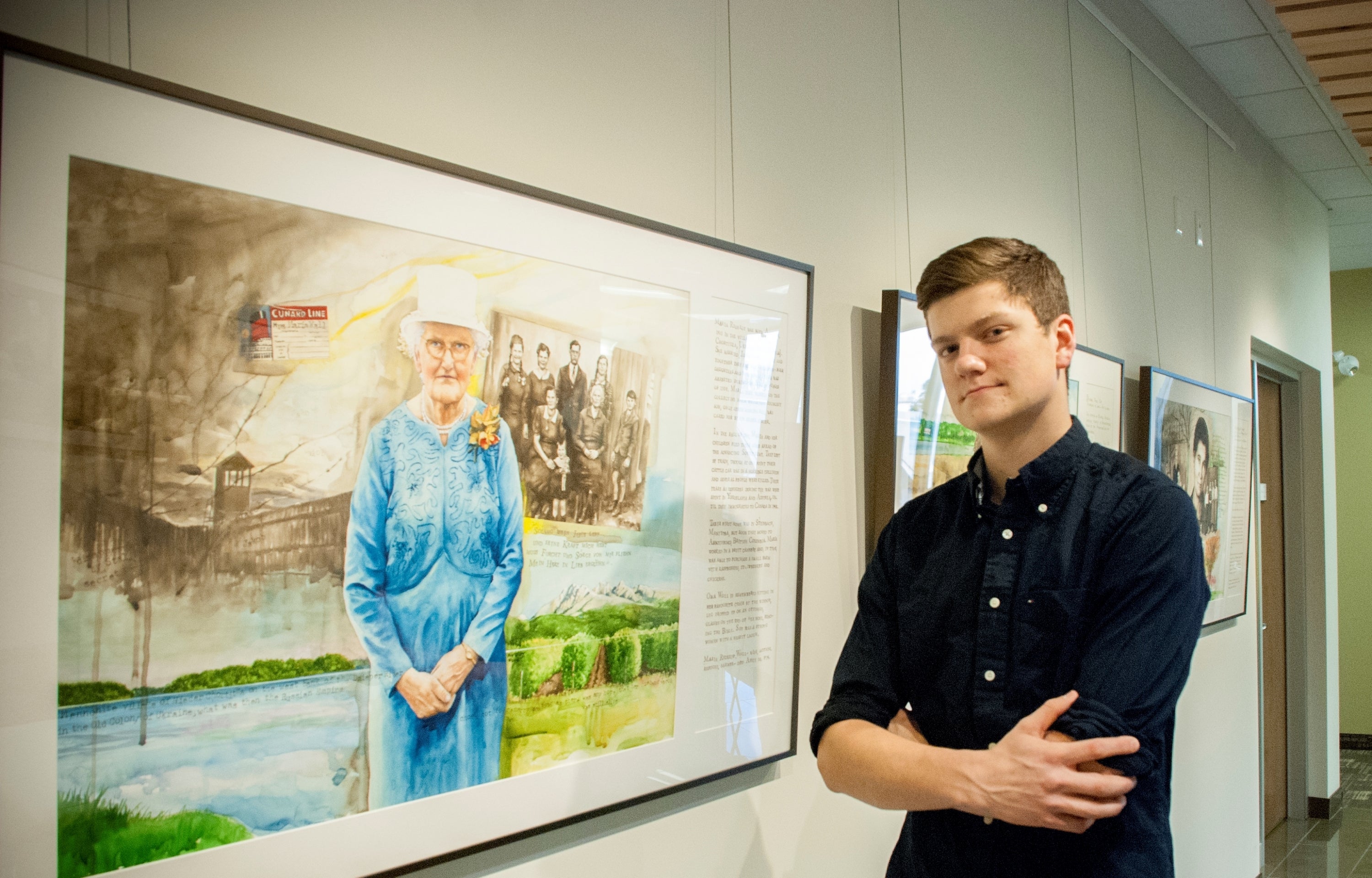 Resident Michael Born stands with the painting  of his great-grandmother, Maria Redekop Wall.