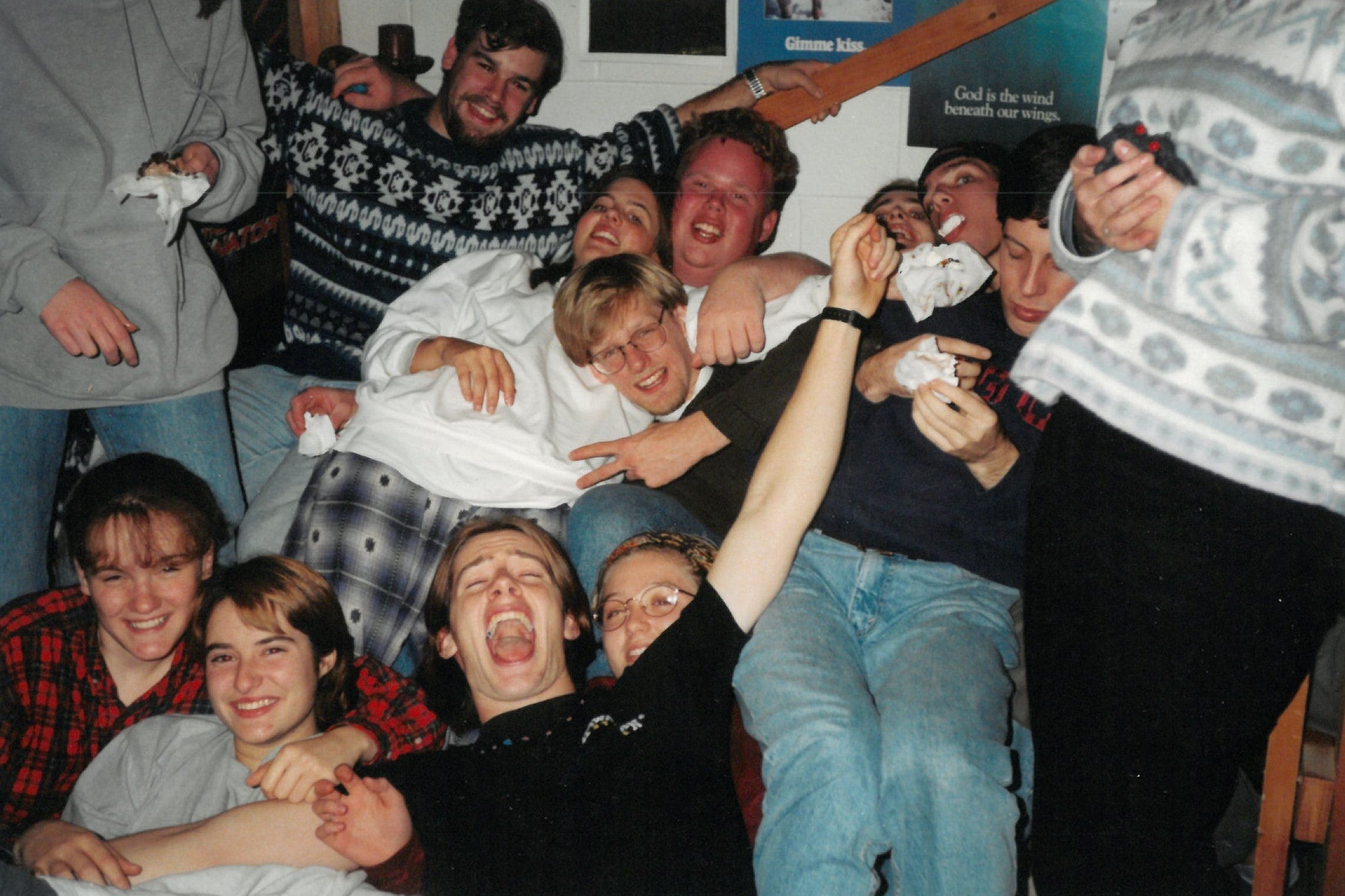 A large group of students sitting close together smiling