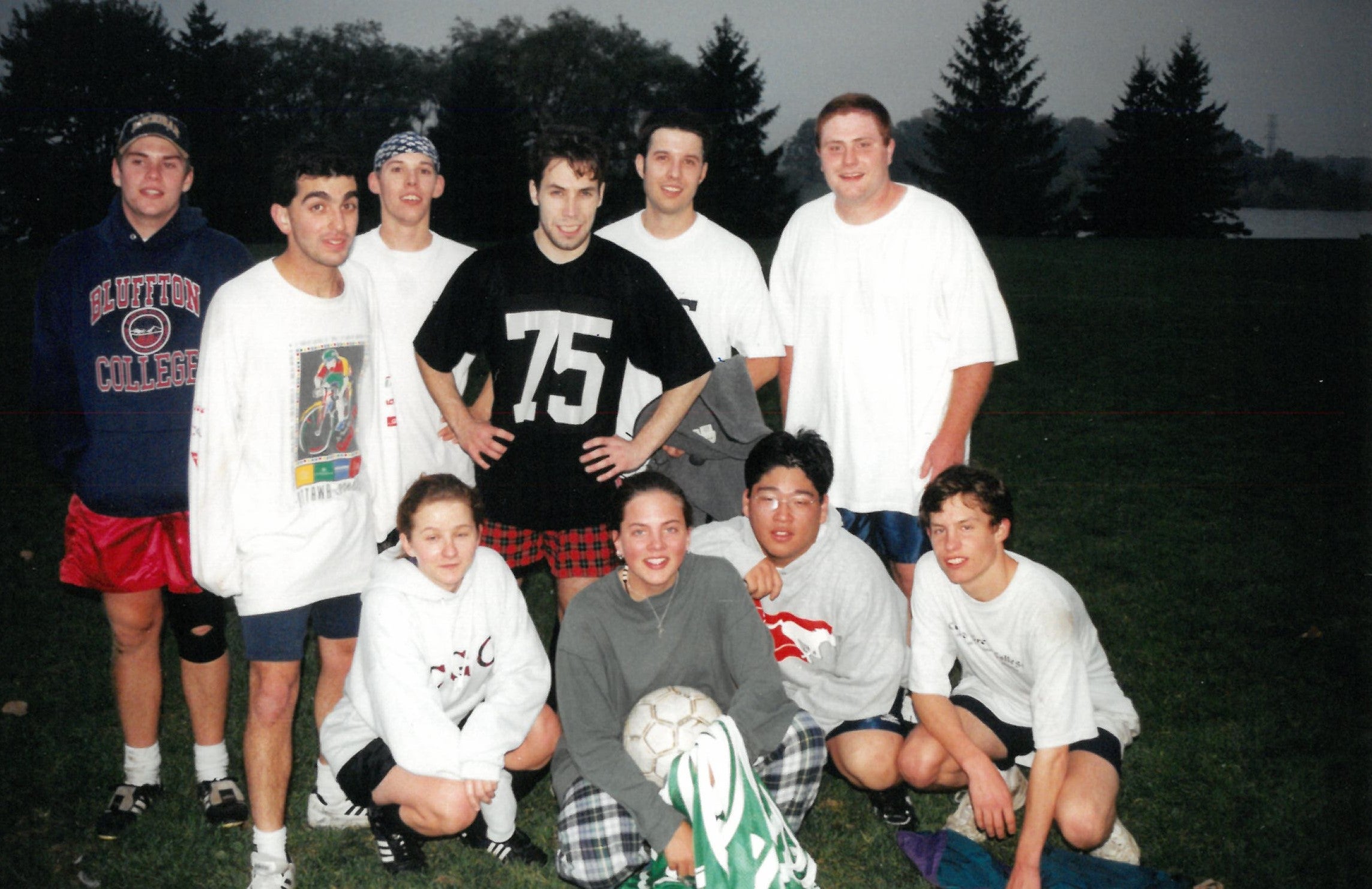 Ten students standing together outside
