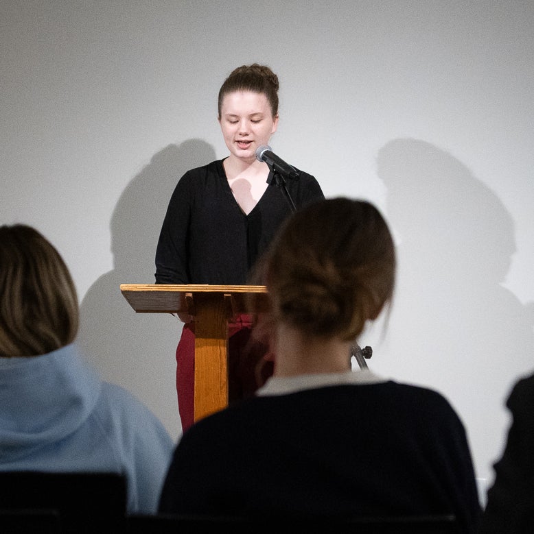 Sophia giving a speech at a lectern