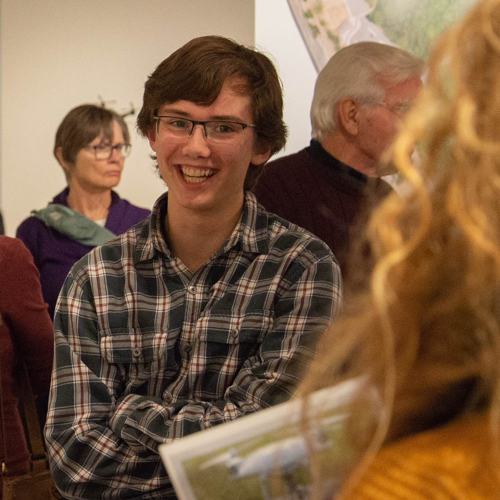 Stuart stands in crowd of students