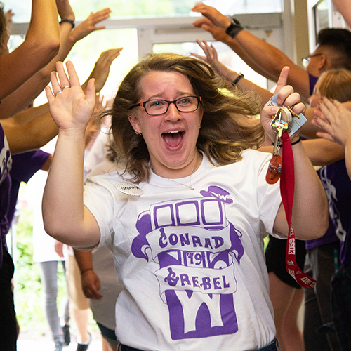 Student welcome high fives