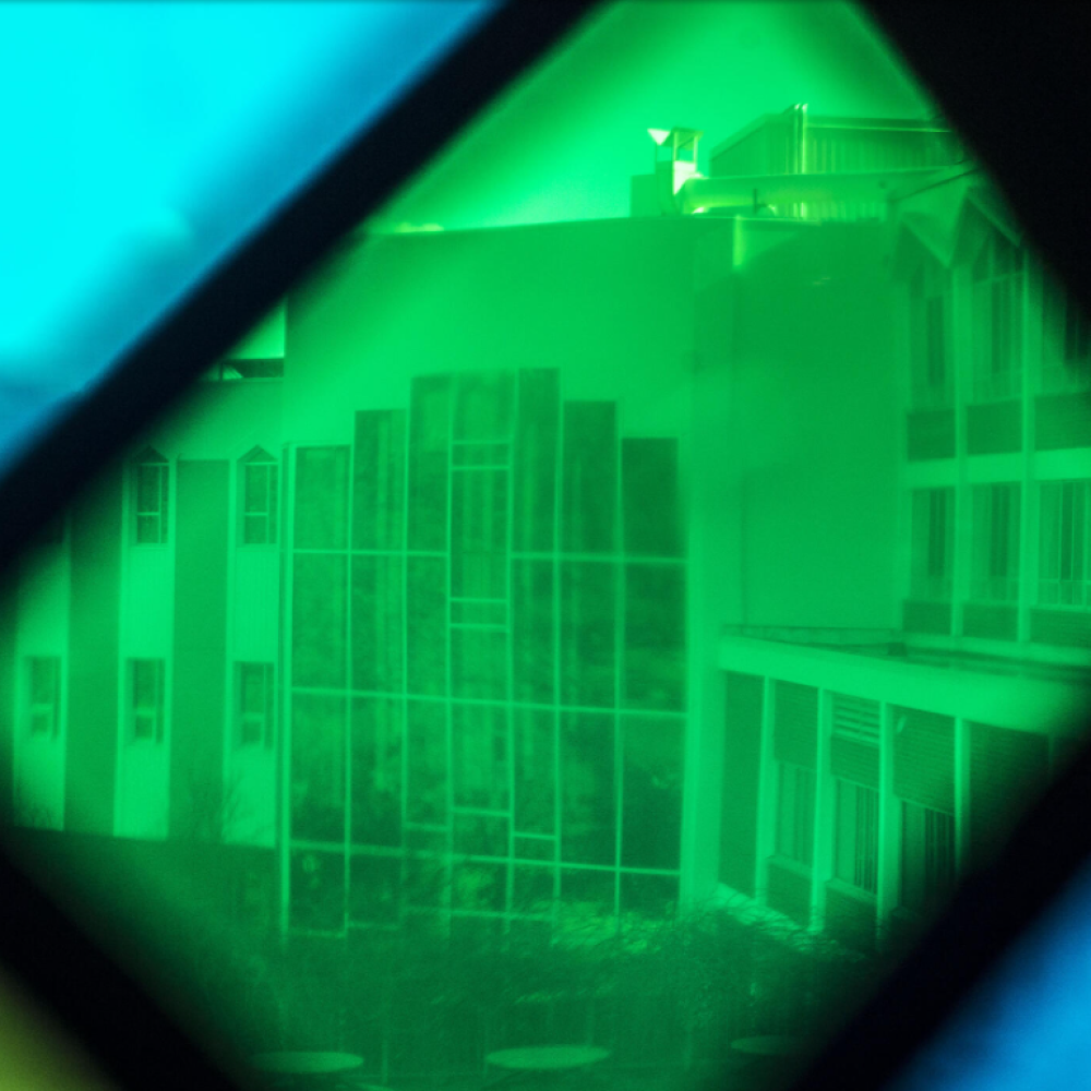 Looking at outside of Grebel building through stained glass window