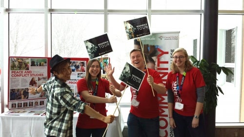 Grebel Students holding tour signs
