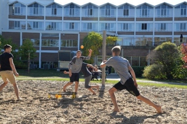 Photo of Grebel students playing spikeball