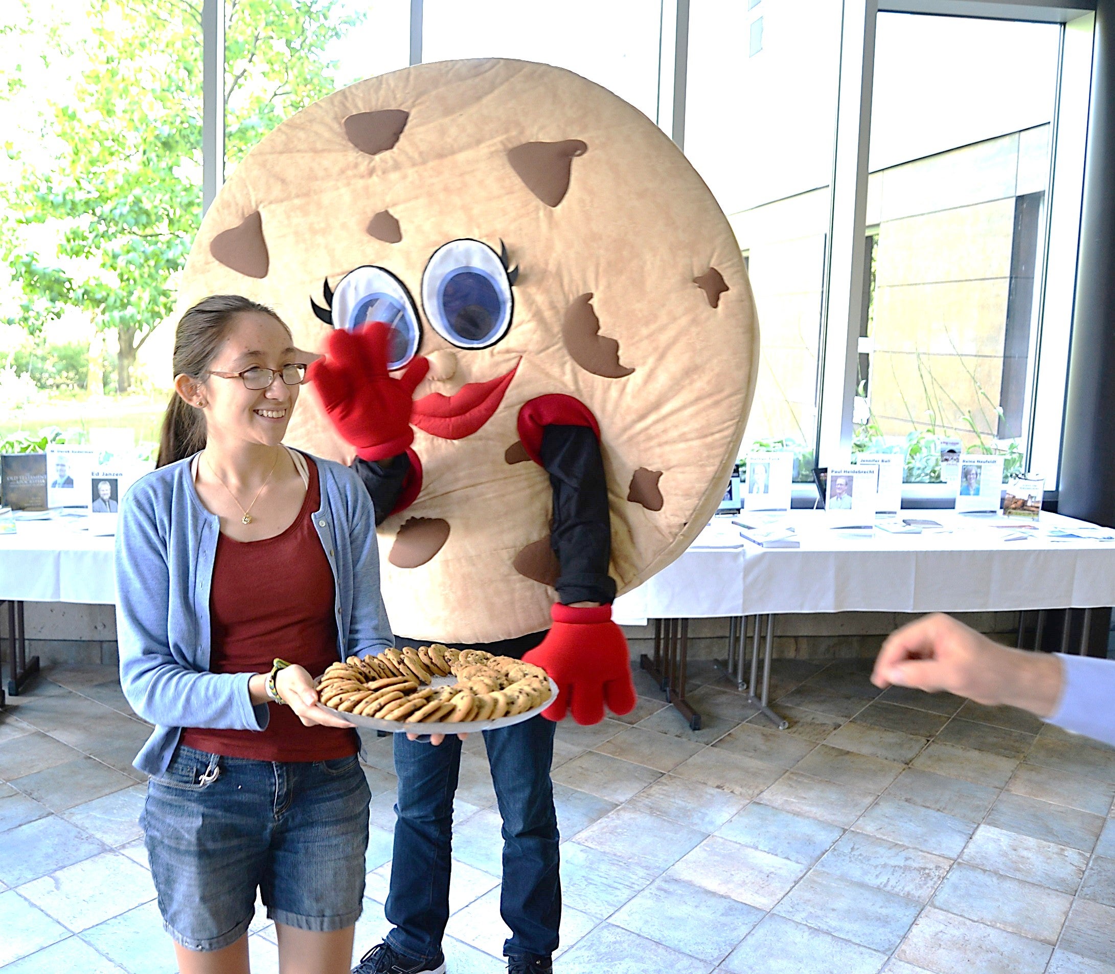 Photo of Grebel student and cookie mascot