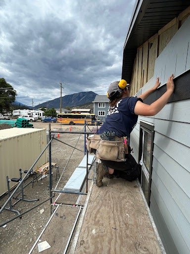 Isabel Song tiling a house at the construction site