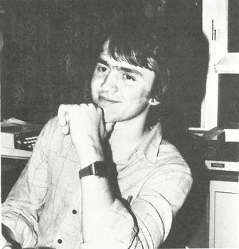 black and white portait of Mark Lichty resting his head on his fist