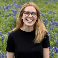 headshot of mykayla in a flower feild 