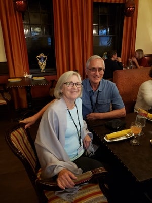Henry Paetkau and his wife pose in a restaurant