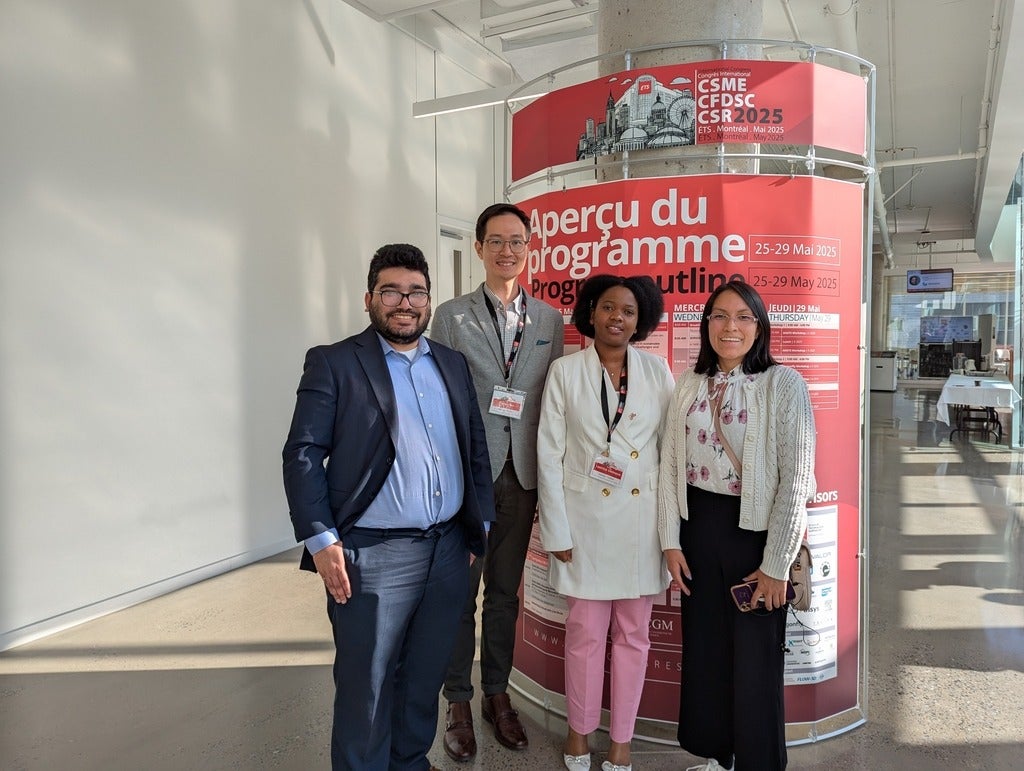group photo in front of a banner