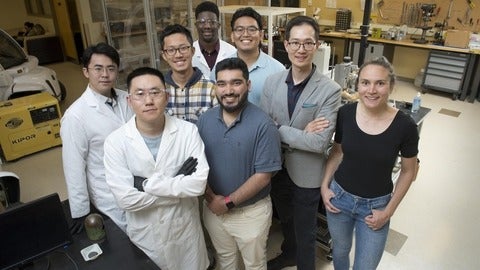 A group of researchers posed in the lab