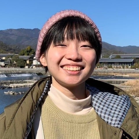a woman student smiling