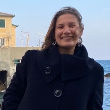 A woman in front of the sea