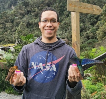 a man in a sweater in nature