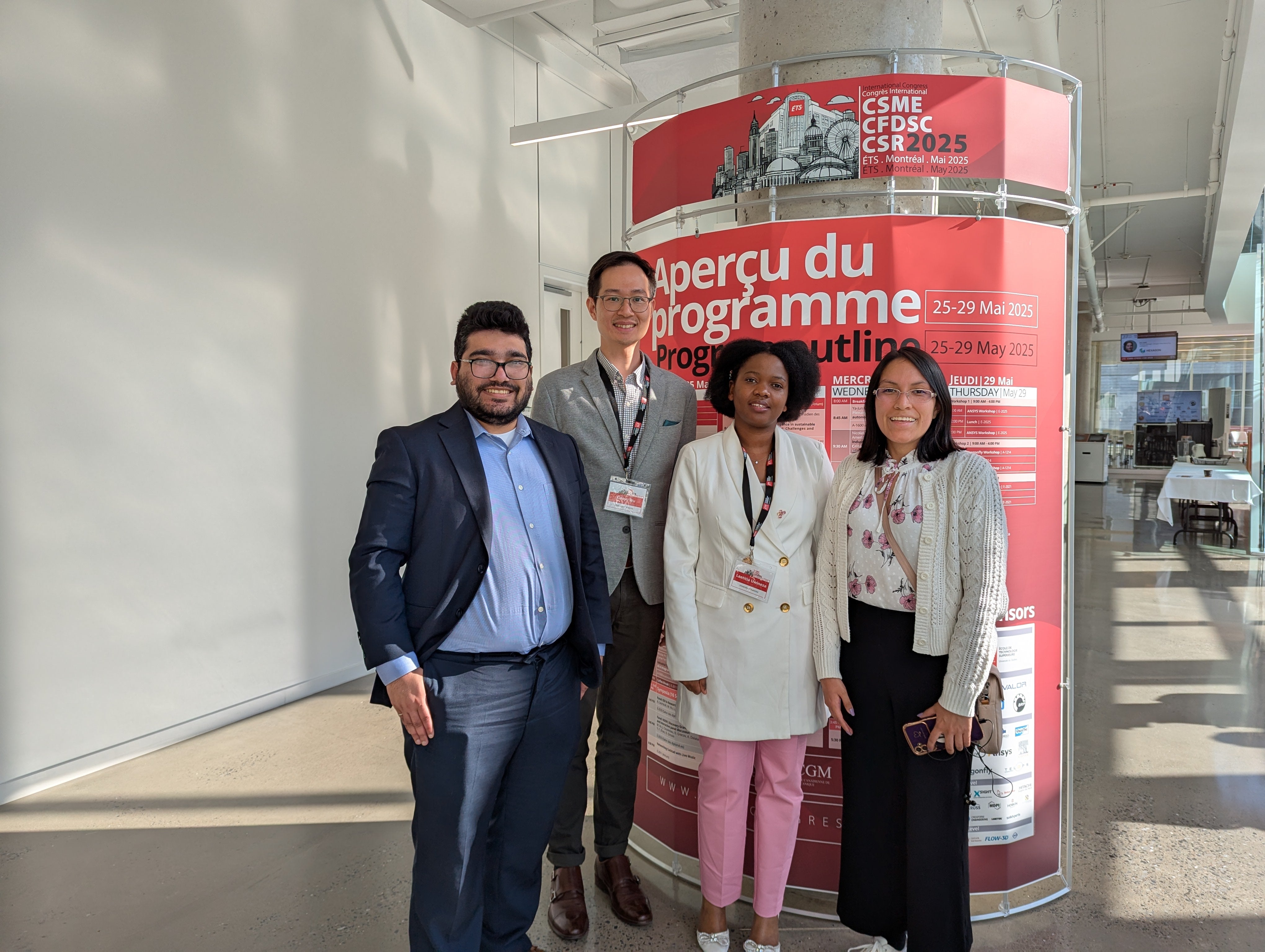 group photo in front of a banner