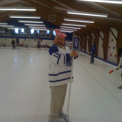 Curlers on the ice.