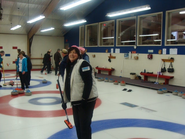 Curlers on the ice.