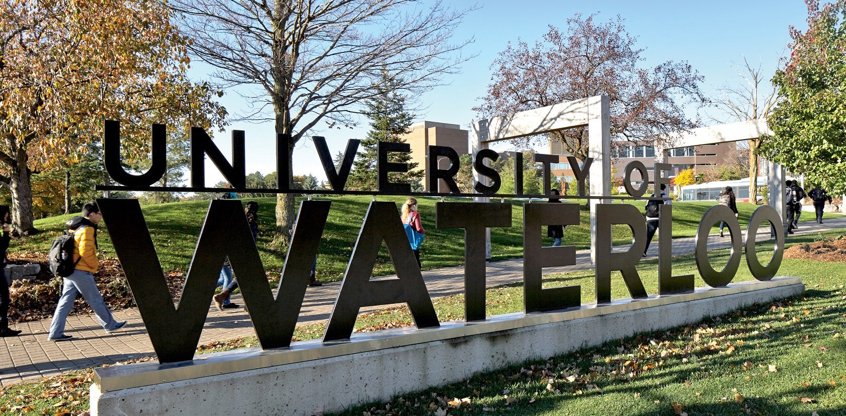 University of Waterloo sign on green campus