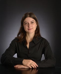 A photo of a woman smiling.