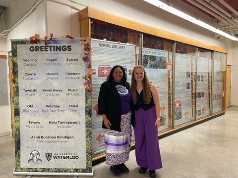 Dr. Leonard and Sophia Armstrong in front of the exhibit