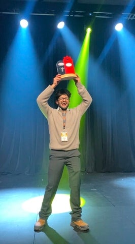 Aniq Premji holding the first prize award at the IISE 2025 conference